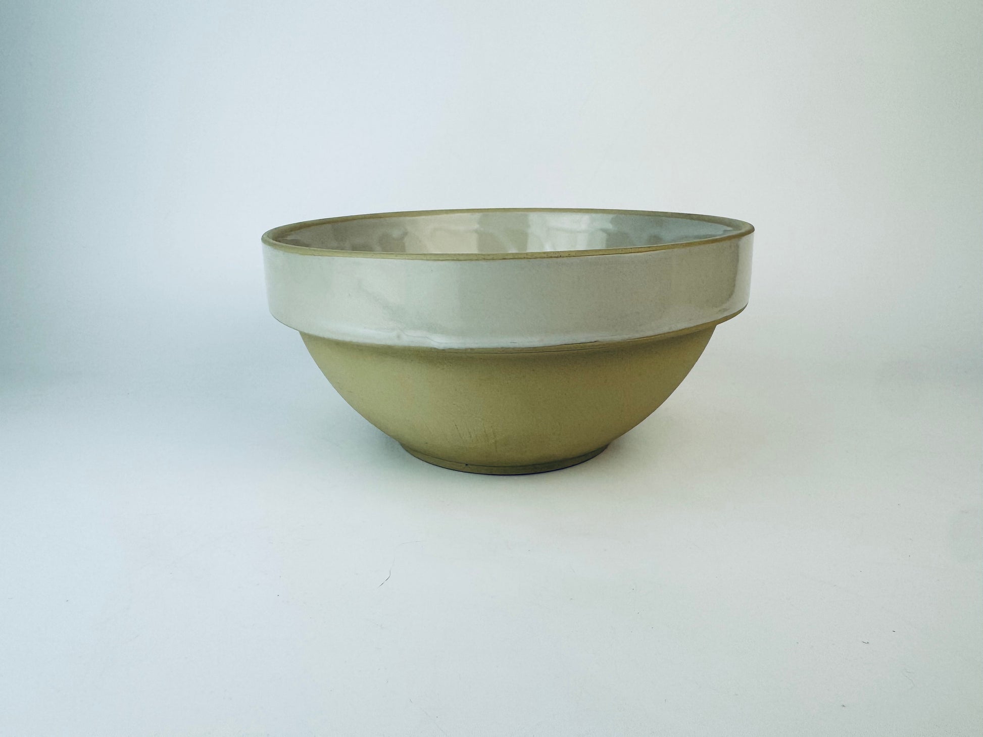 Ceramic bowl with two-tone design on a white background