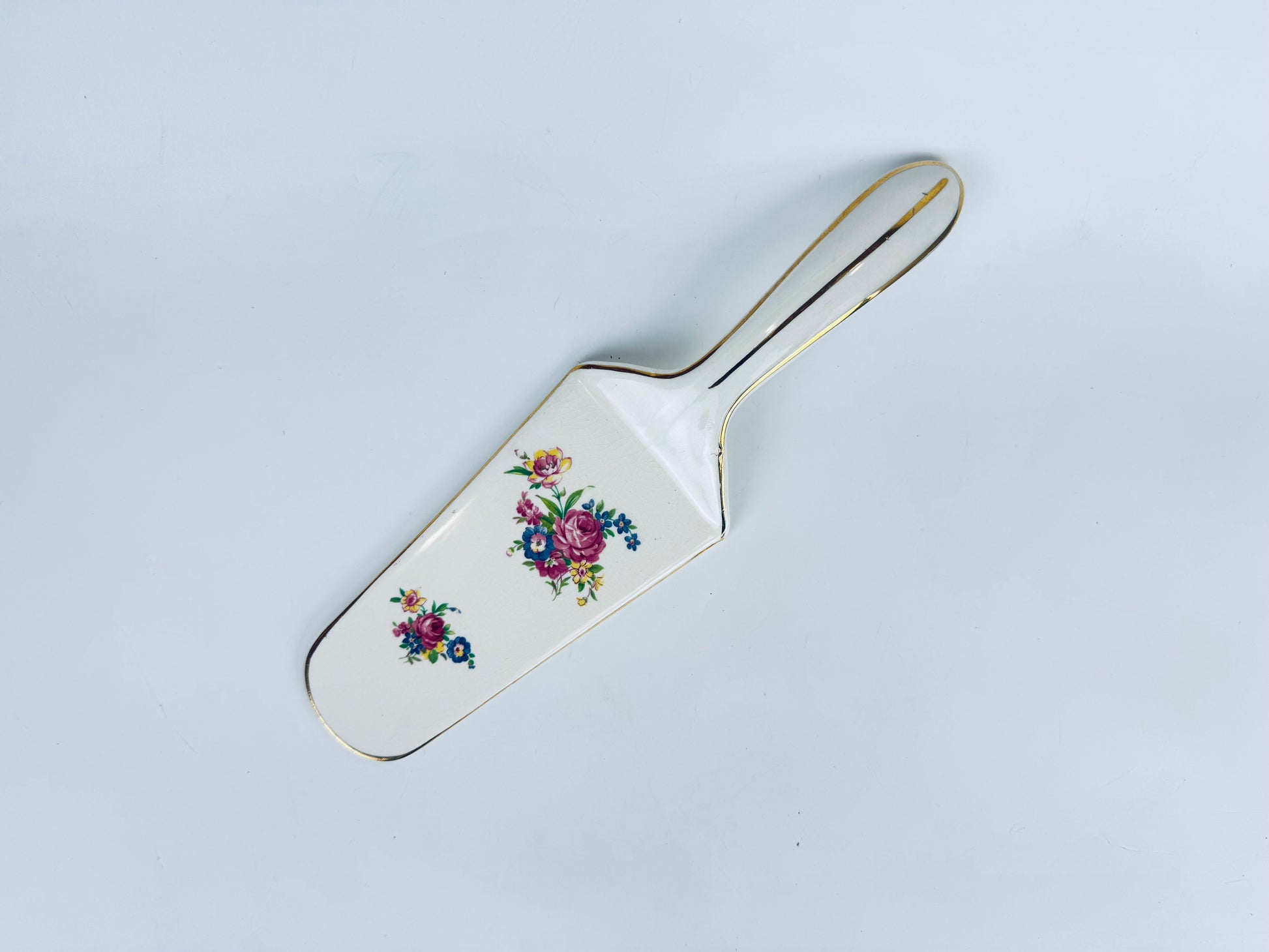 Vintage ceramic Royal Tudor Ware floral cake server with gold trim by Barker Bros. Ltd, England (mid-century).