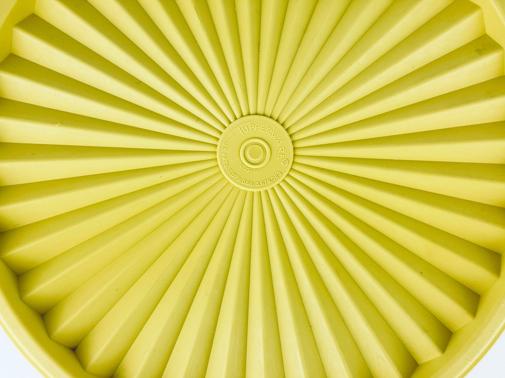 Product image for 'vintage yellow starburst design plastic tupperware stackable nesting countertop container 1204 1205 made in canada' (view 19642e)