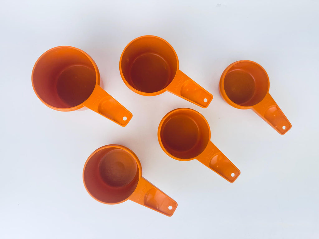 Product image for 'vintage stacking plastic tupperware measuring cups set of five 5 made in canada sets sold separately' (view c5e0e0)