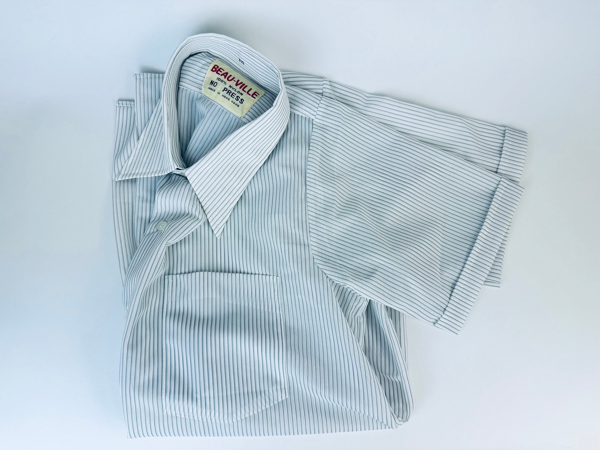 Product image for 'vintage 1970s blue grey striped short sleeve button up shirts 100 nylon made in hong kong by beau ville sold separately' (view 373e7d)