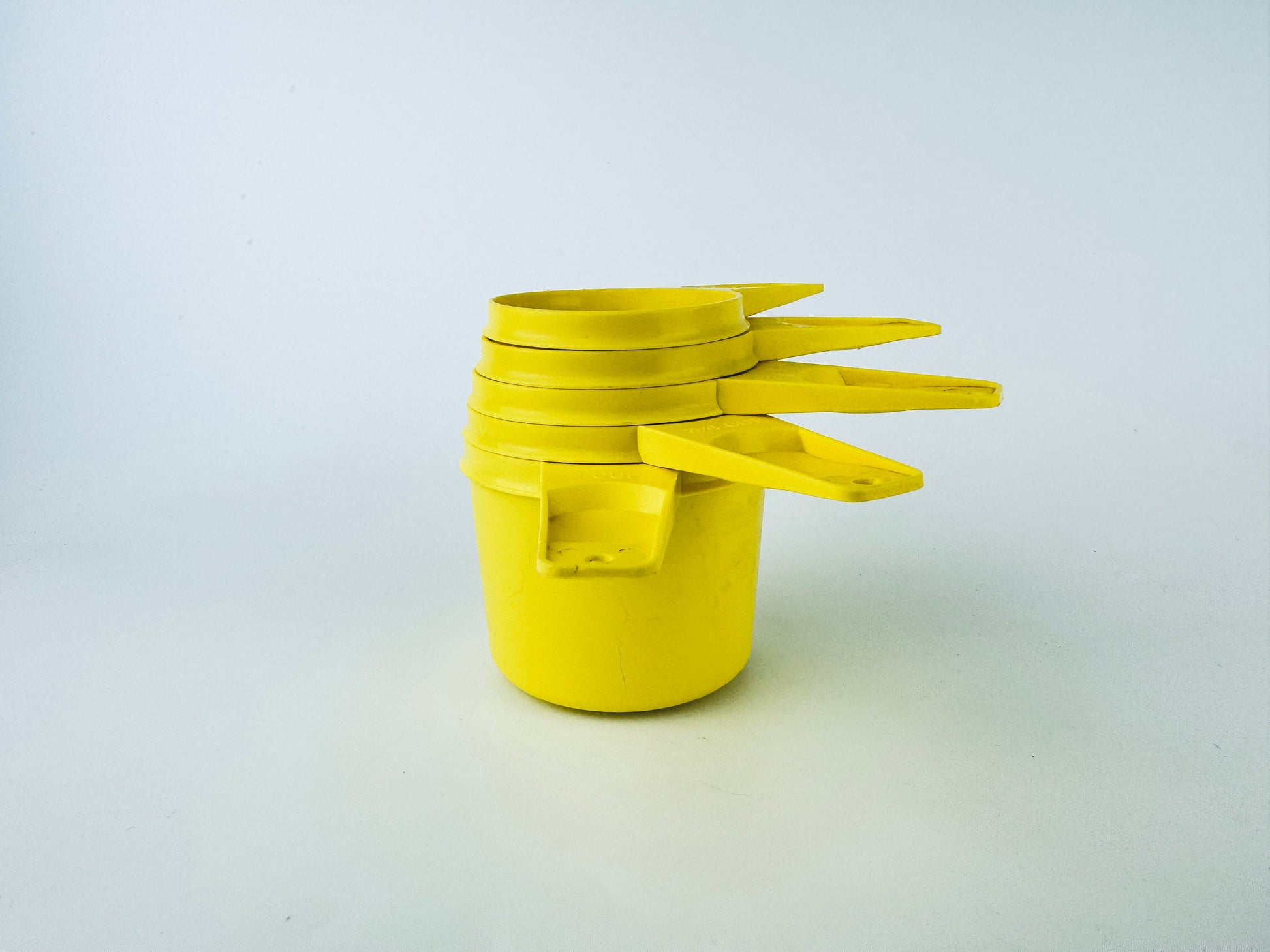 Product image for 'vintage stacking plastic tupperware measuring cups set of five 5 made in canada sets sold separately' (view afc97b)