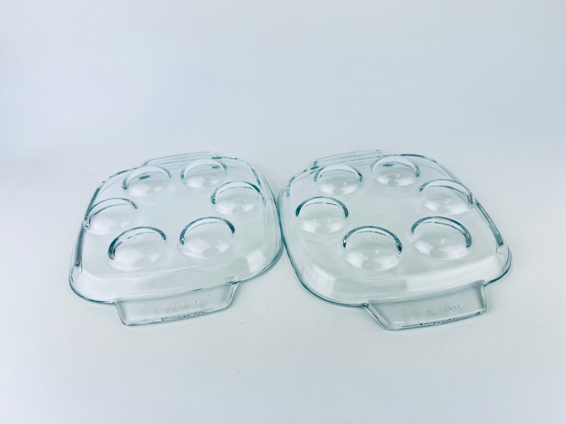 Product image for 'vintage pyrex clear glass escargot snail devilled egg plates 473 set of two 2 made in france' (view bbd3b1)