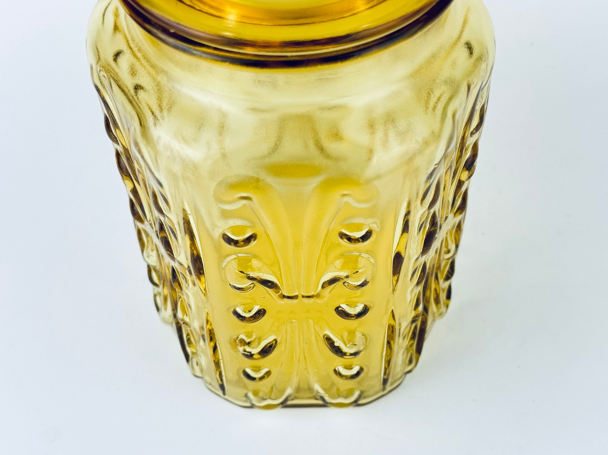 Product image for 'vintage federal glass amber scroll pattern lidded apothecary jar made in usa' (view 35a89b)