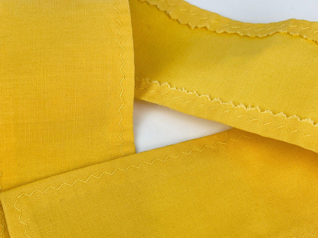 Product image for 'vintage yellow black embroidered waist apron right pocket detail' (view b5924c)