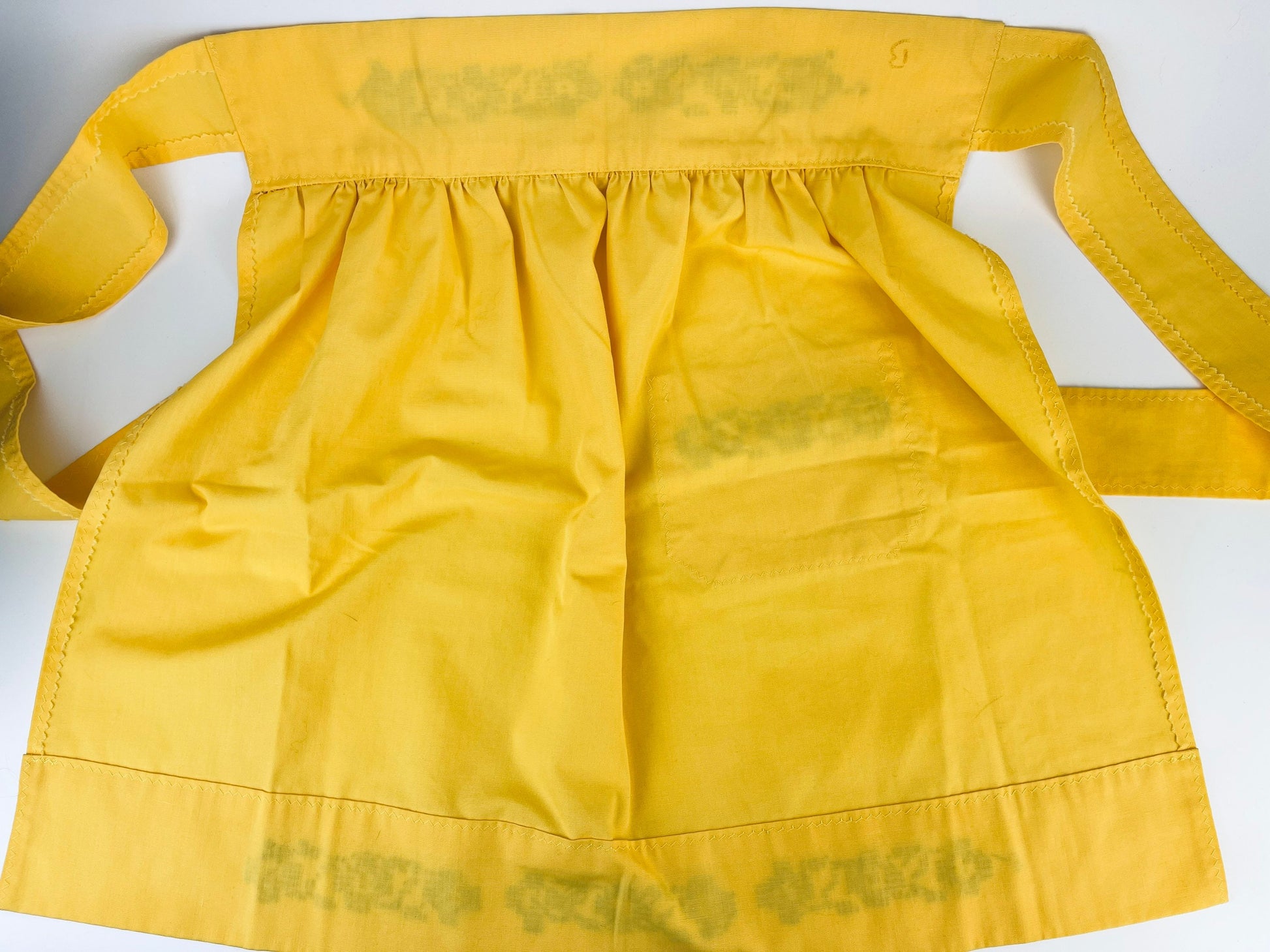 Product image for 'vintage yellow black embroidered waist apron right pocket detail' (view bcf02f)