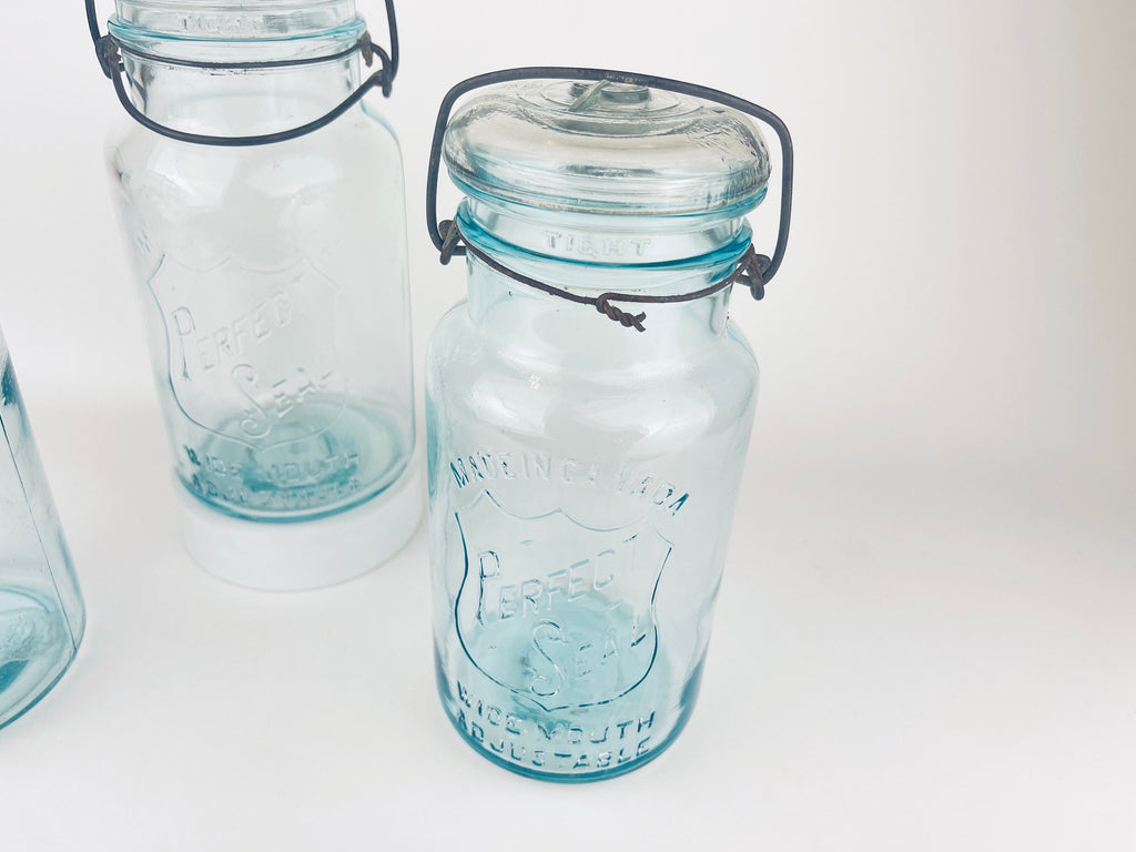 Product image for 'antique safety seal wide mouth aqua blue glass jar 2 pint capacity lightning metal hinge clasp made in canada sold separately' (view 2e3f98)