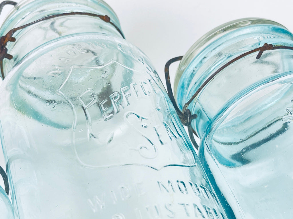 Product image for 'antique safety seal wide mouth aqua blue glass jar 2 pint capacity lightning metal hinge clasp made in canada sold separately 1' (view 9d0af5)