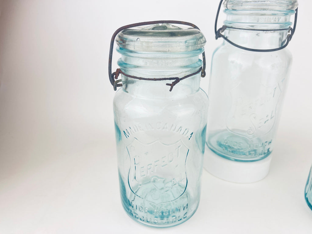 Product image for 'antique safety seal wide mouth aqua blue glass jar 2 pint capacity lightning metal hinge clasp made in canada sold separately' (view 3825f3)