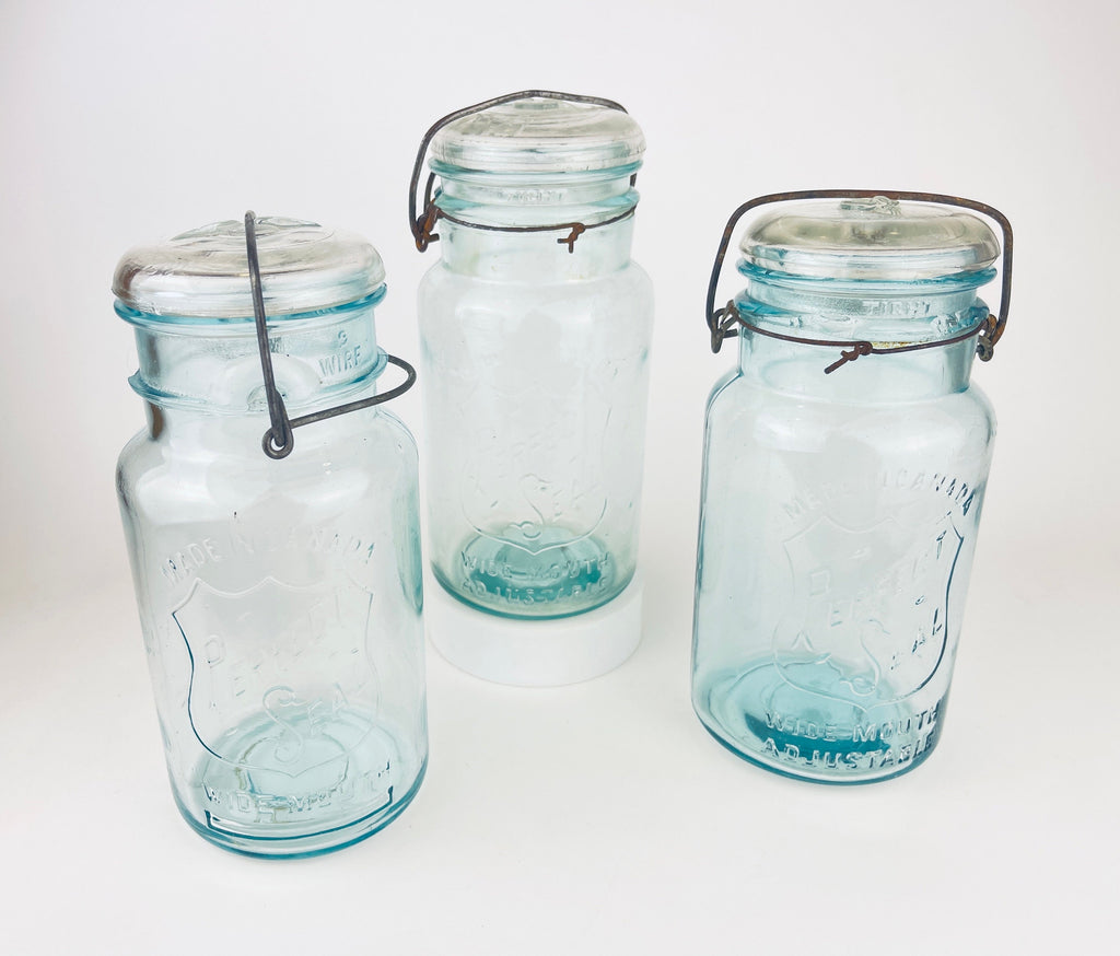 Product image for 'antique safety seal wide mouth aqua blue glass jar 2 pint capacity lightning metal hinge clasp made in canada sold separately 1' (view afa38d)