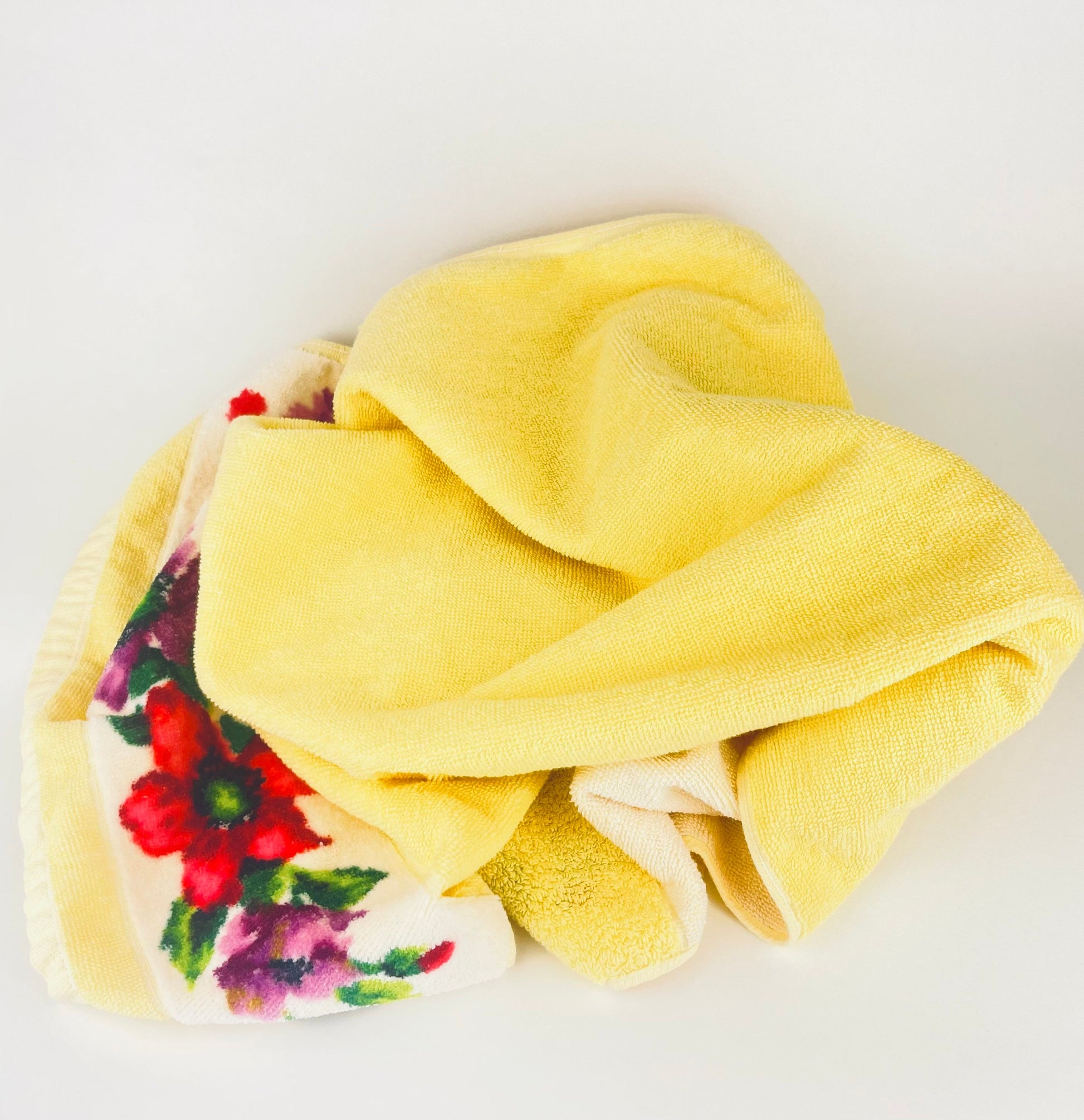 Yellow towel with floral pattern on a white background