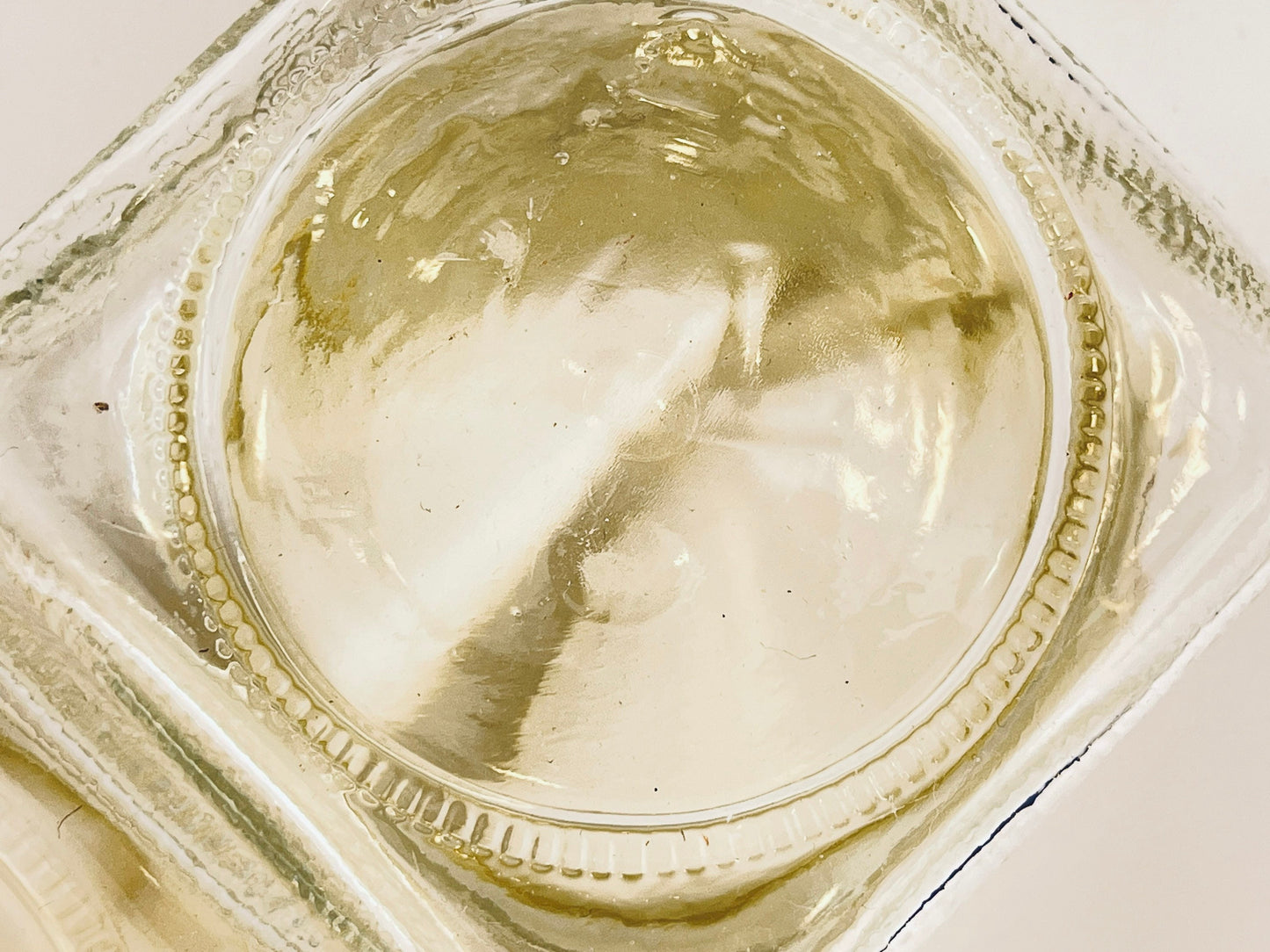Close-up of the bottom of the jar on a white background