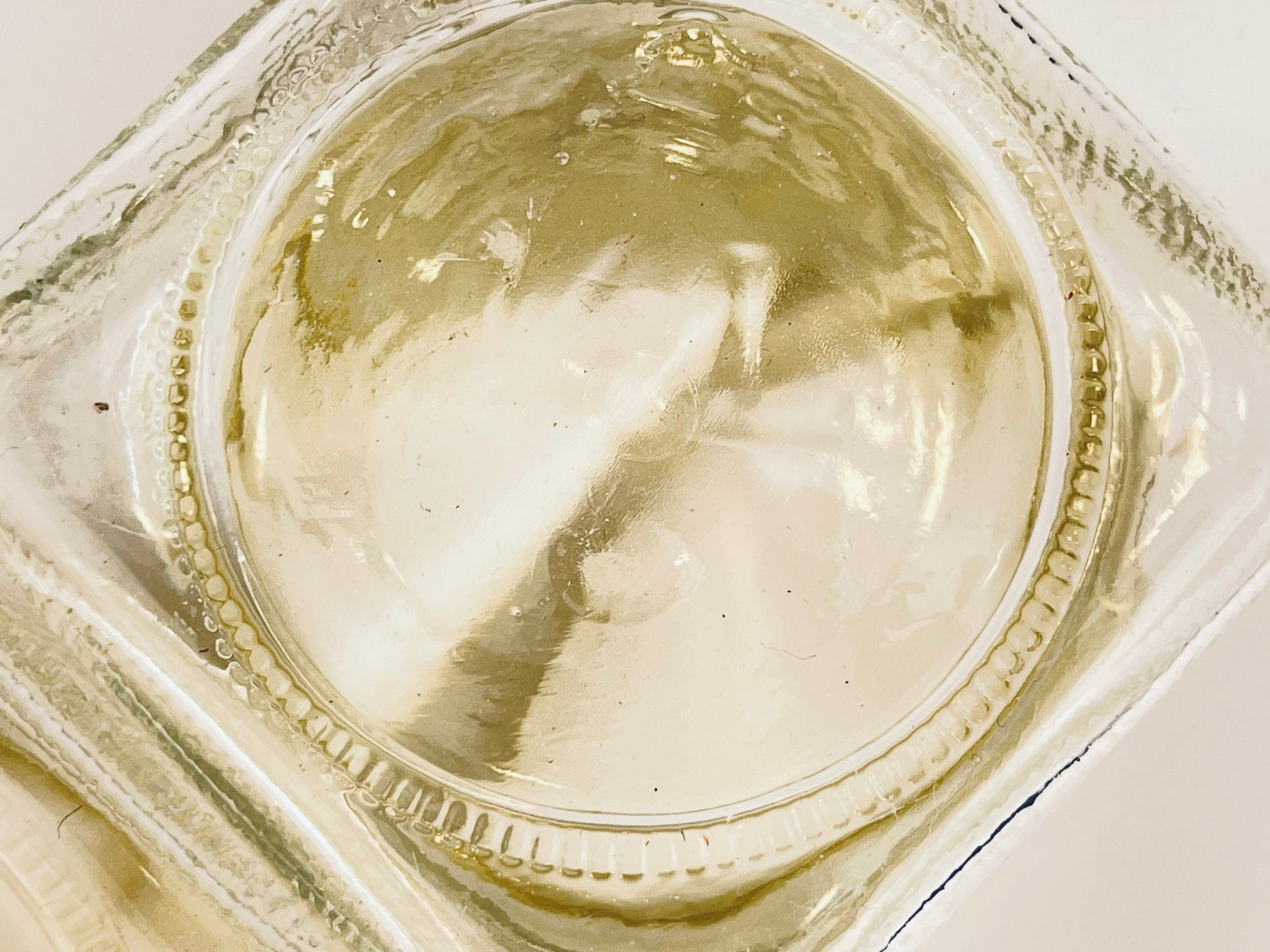 Close-up of the bottom of the jar on a white background