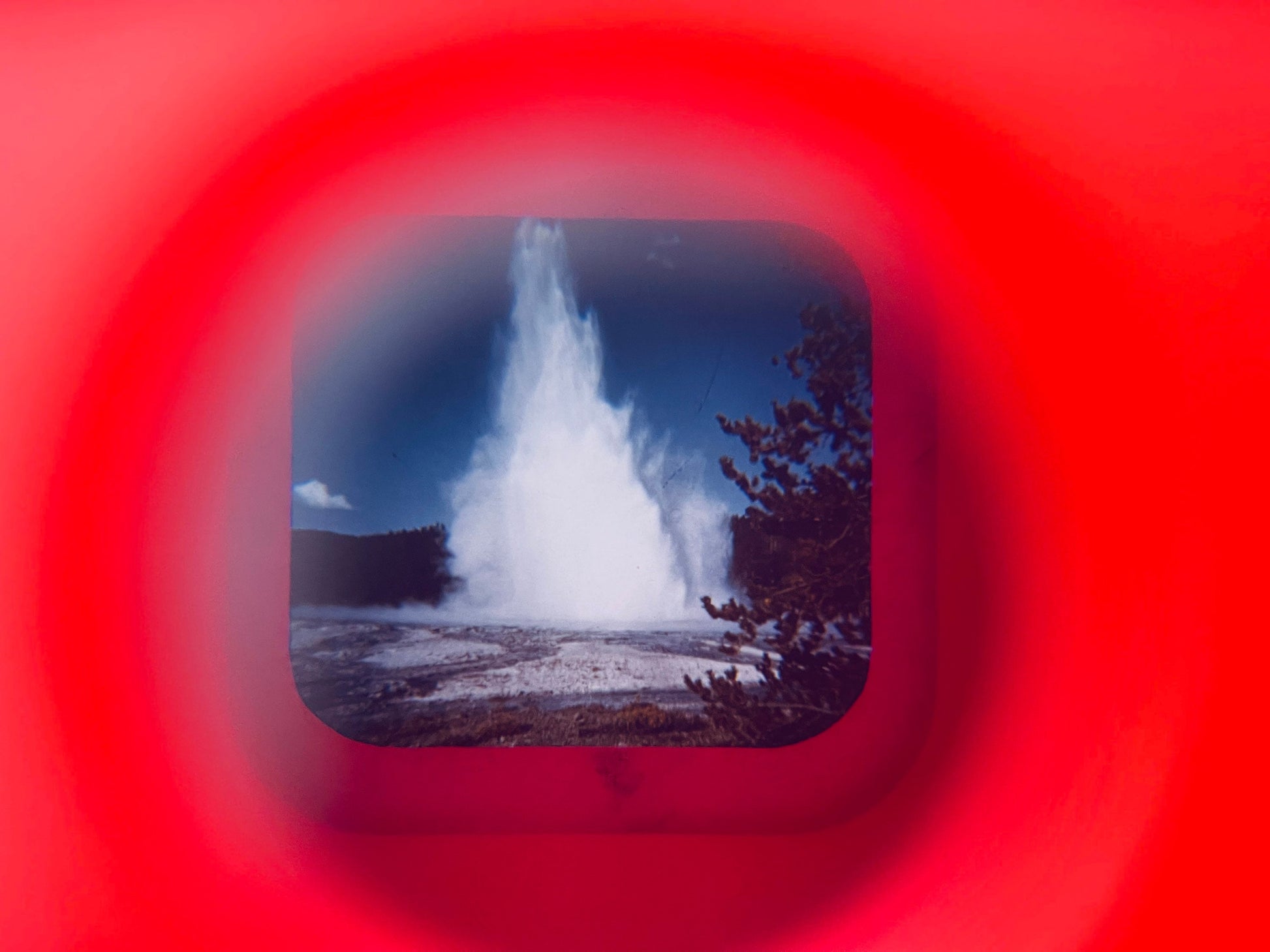 Geothermal geyser with a red circular frame overlay
