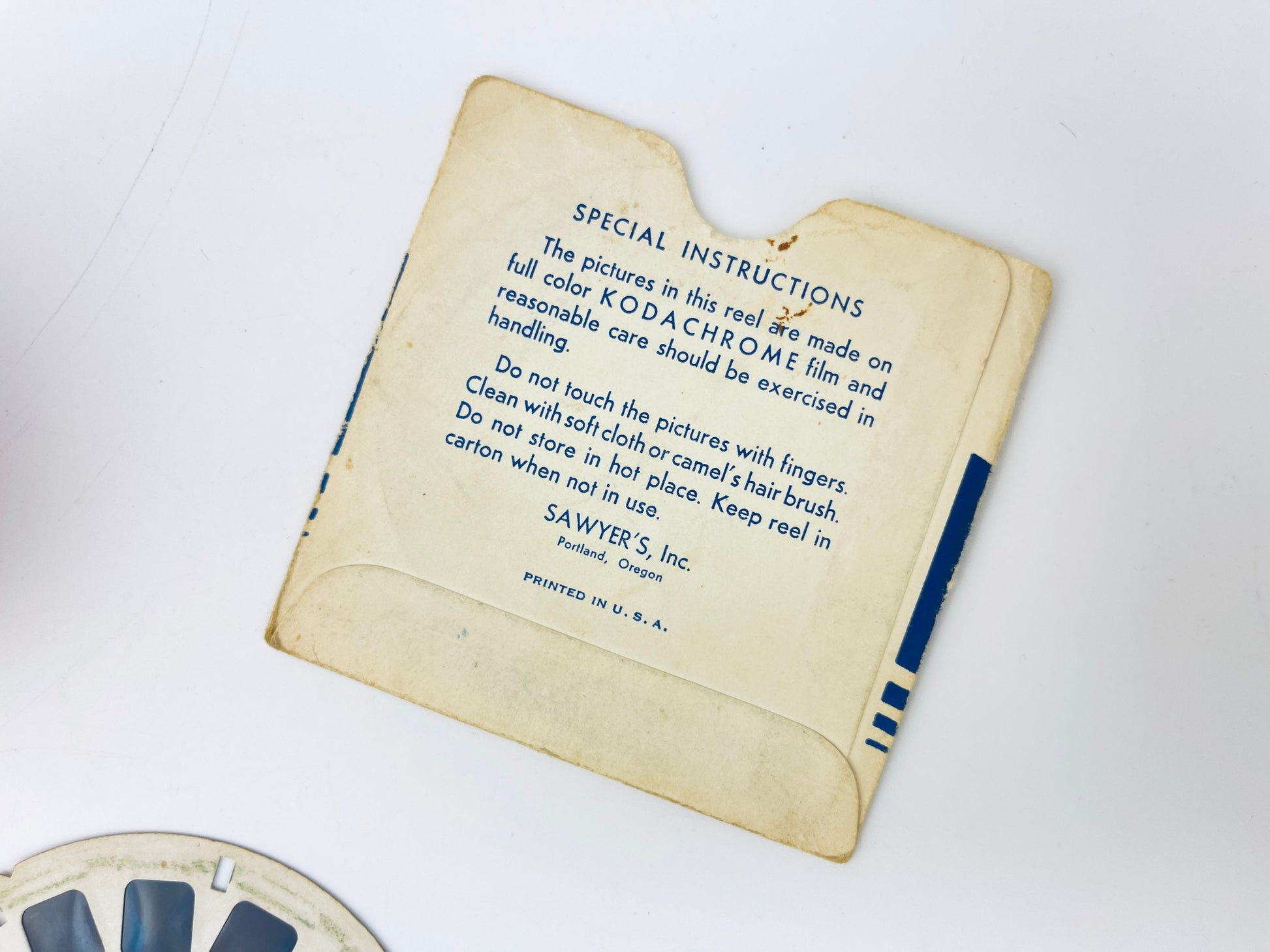 Vintage Kodak film cartridge with instructions on a white background