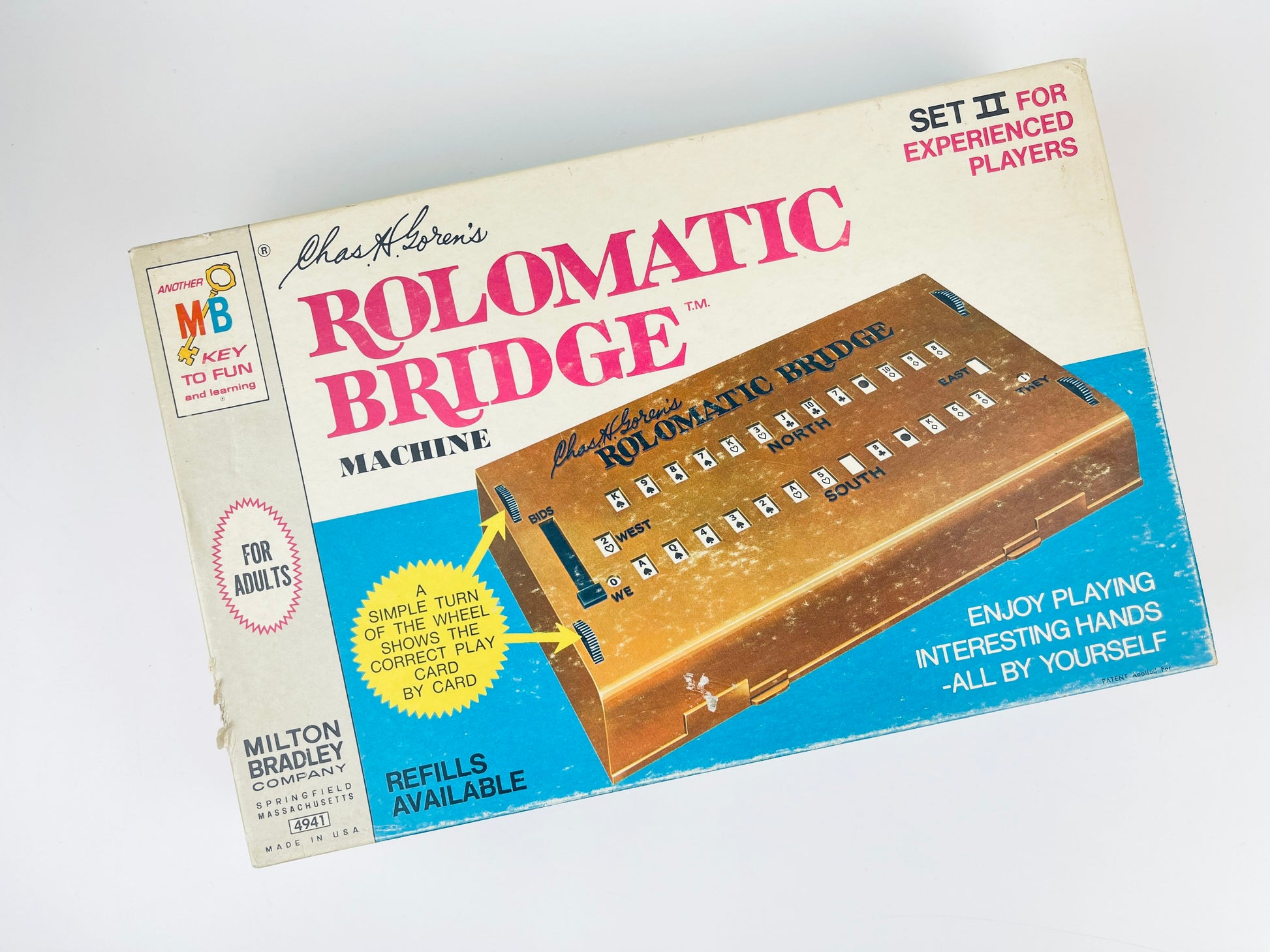 Box of Rolomatic Bridge machine by Milton Bradley on a white background