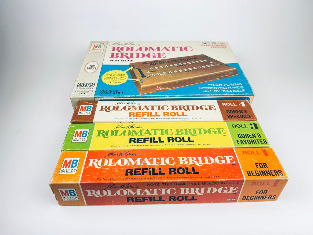 Three boxes of Rolomatic Bridge products on a white background