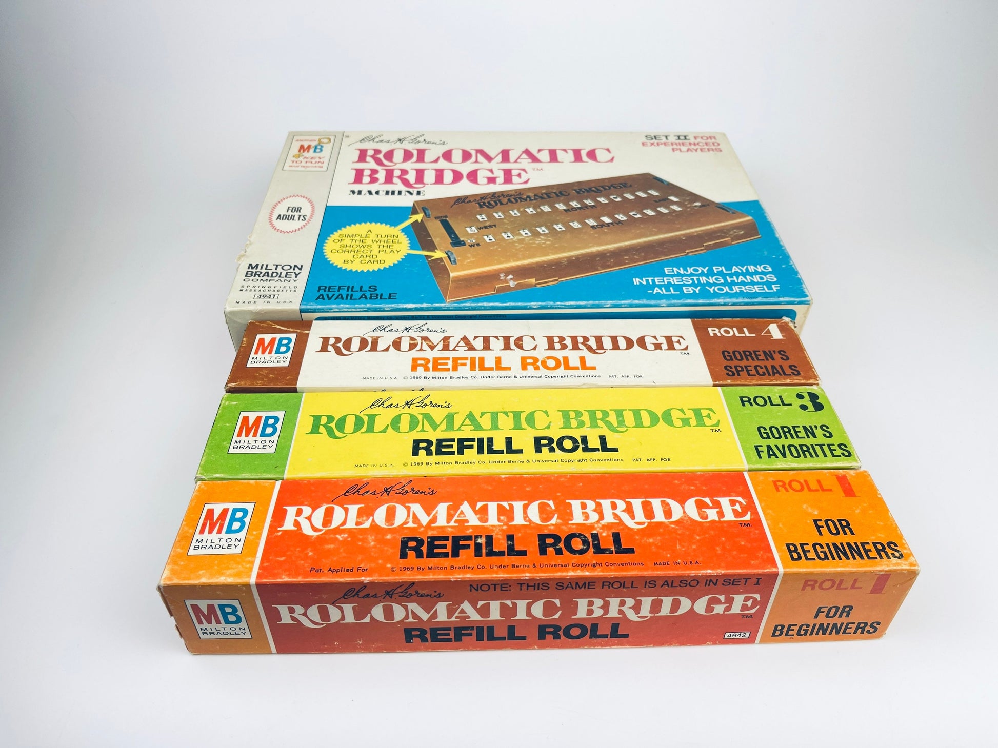 Three boxes of Rolomatic Bridge products on a white background