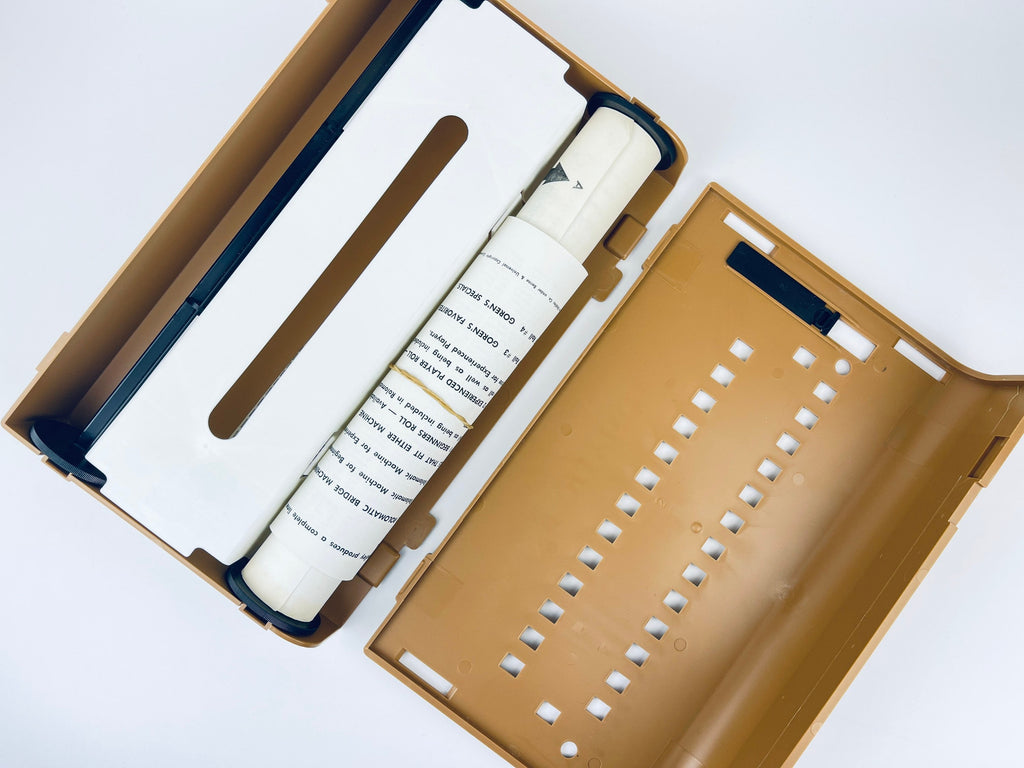 Brown box with a white cylindrical object inside on a white background