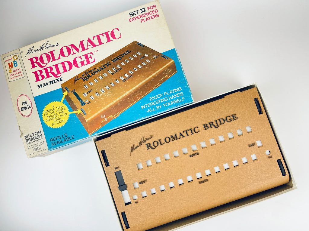 Rolomatic Bridge machine with packaging on a white background