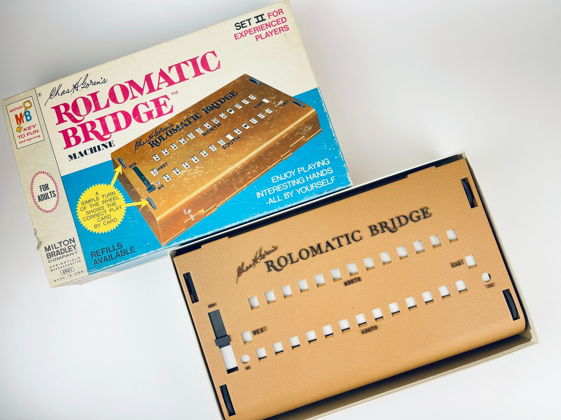 Rolomatic Bridge machine with packaging on a white background