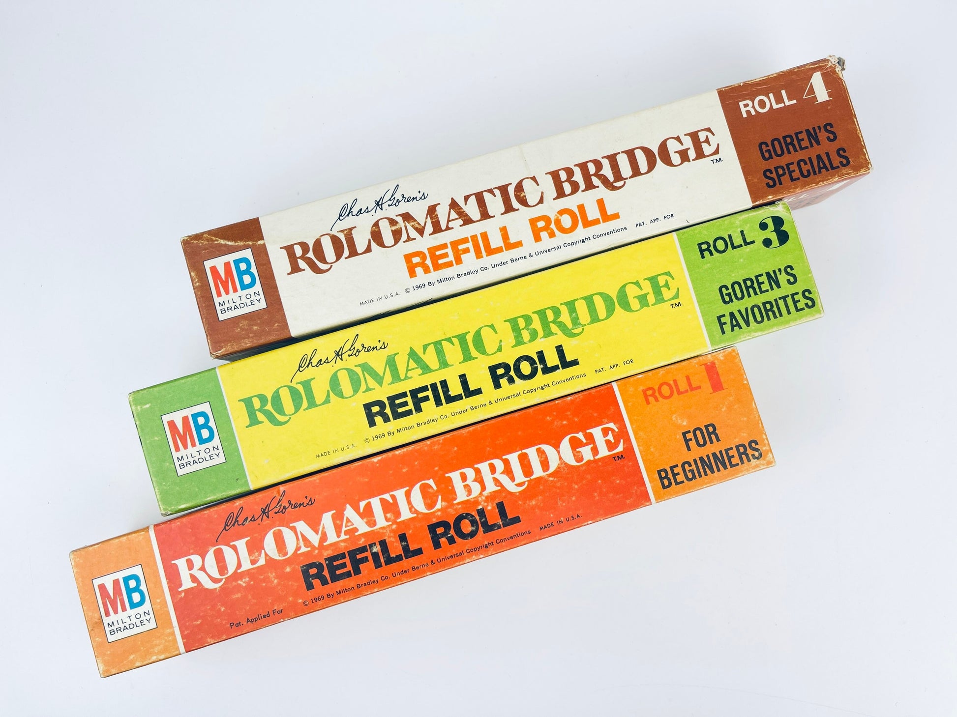 Three Rolomatic Bridge Refill Roll boxes from MB on a white background