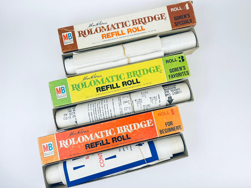 Three Rolomatic Bridge Refill Rolls with their packaging on a white background
