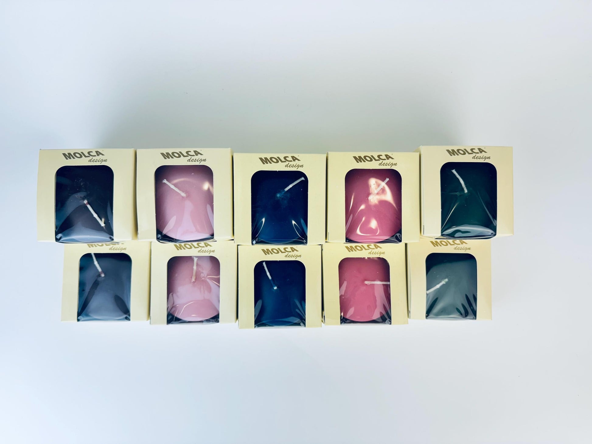 Set of Molca candles in packaging on a white background