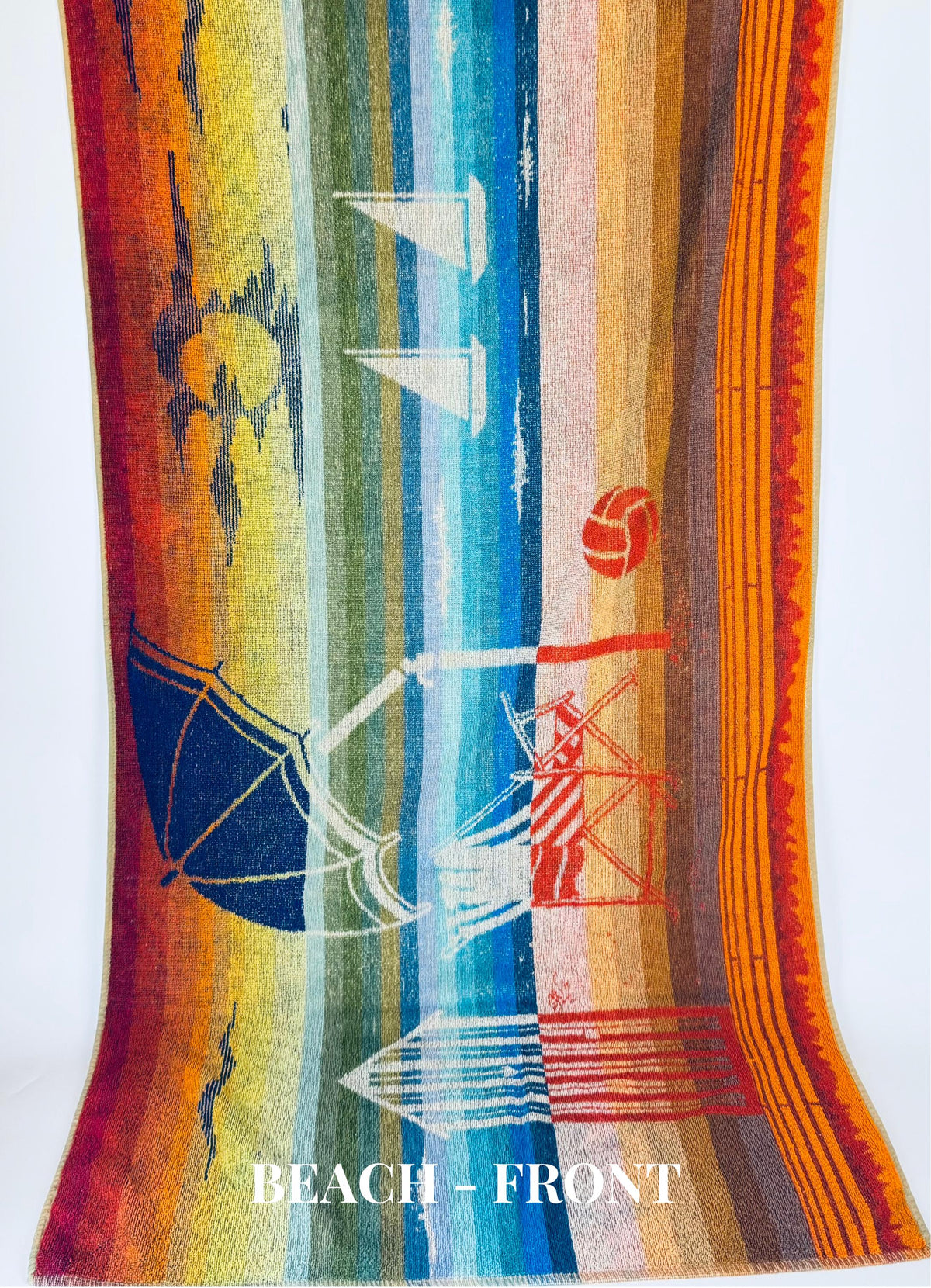 Colorful towel with beach-themed designs on a white background