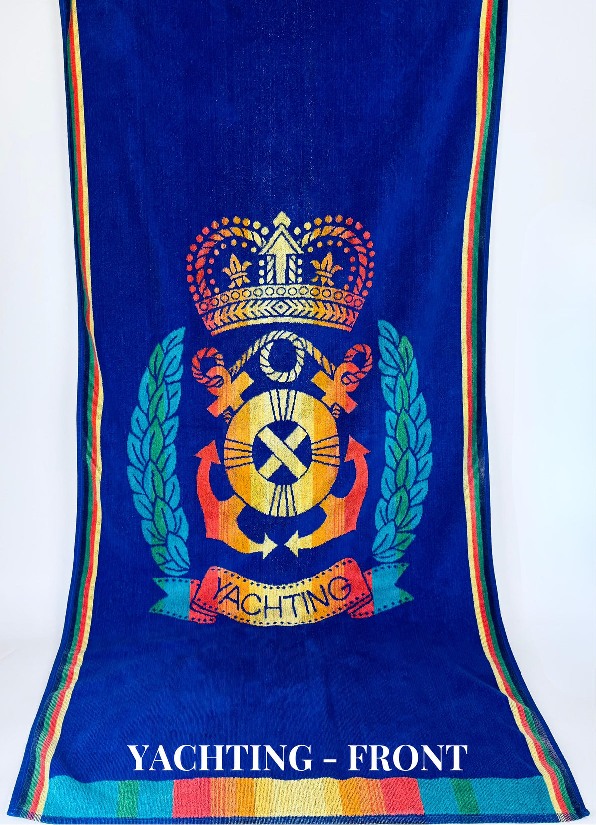 Blue towel with colorful yachting emblem and text on a white background