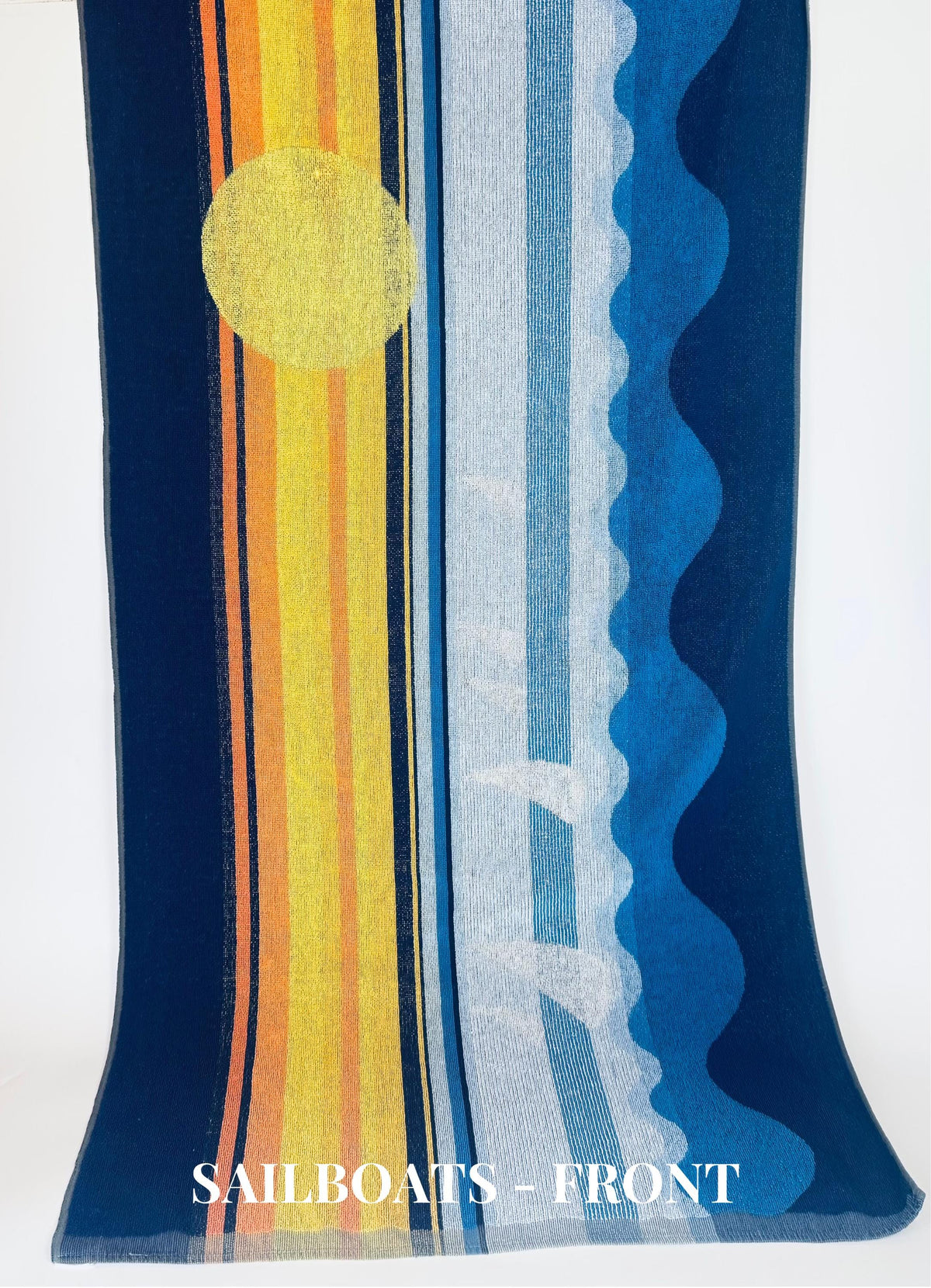 Colorful fabric with sailboat design on a white background