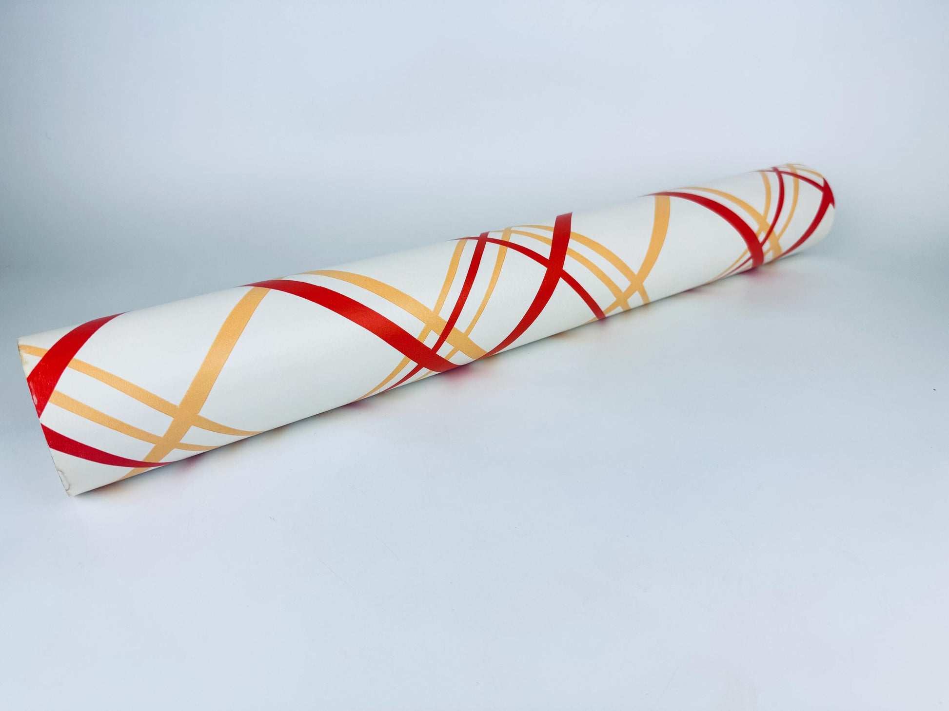 Wallpaper with red and yellow plaid pattern on a white background