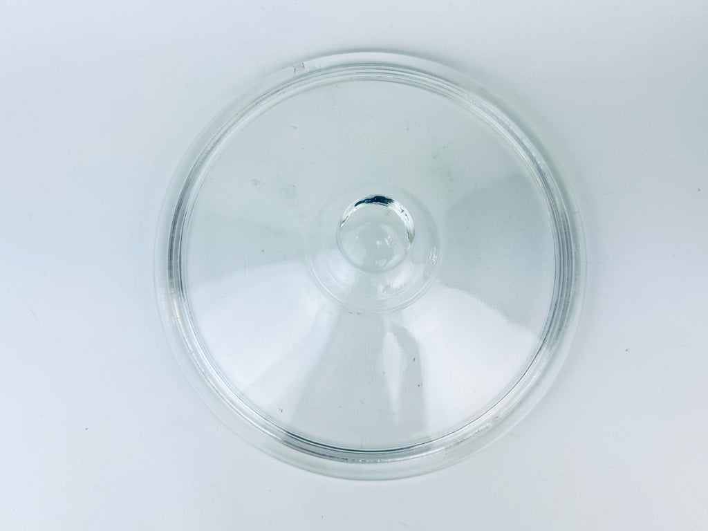 Clear glass lid on a white background