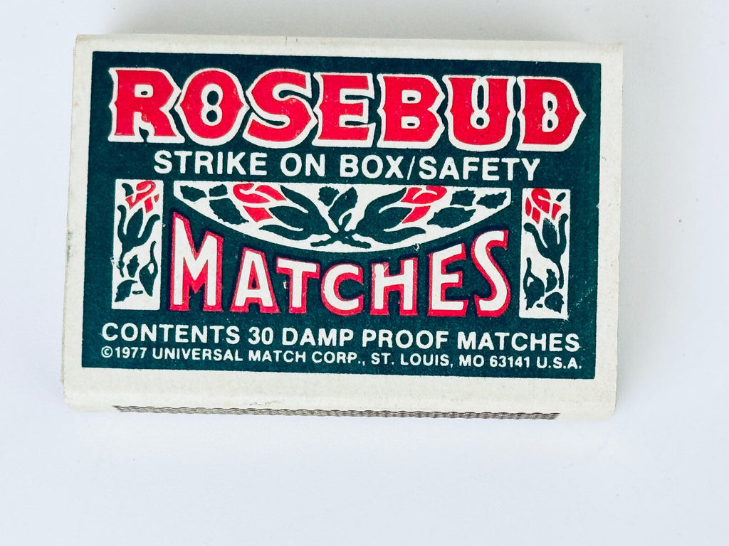 Matchbox labeled 'Rosebud Matches' with branding and product details on a white background