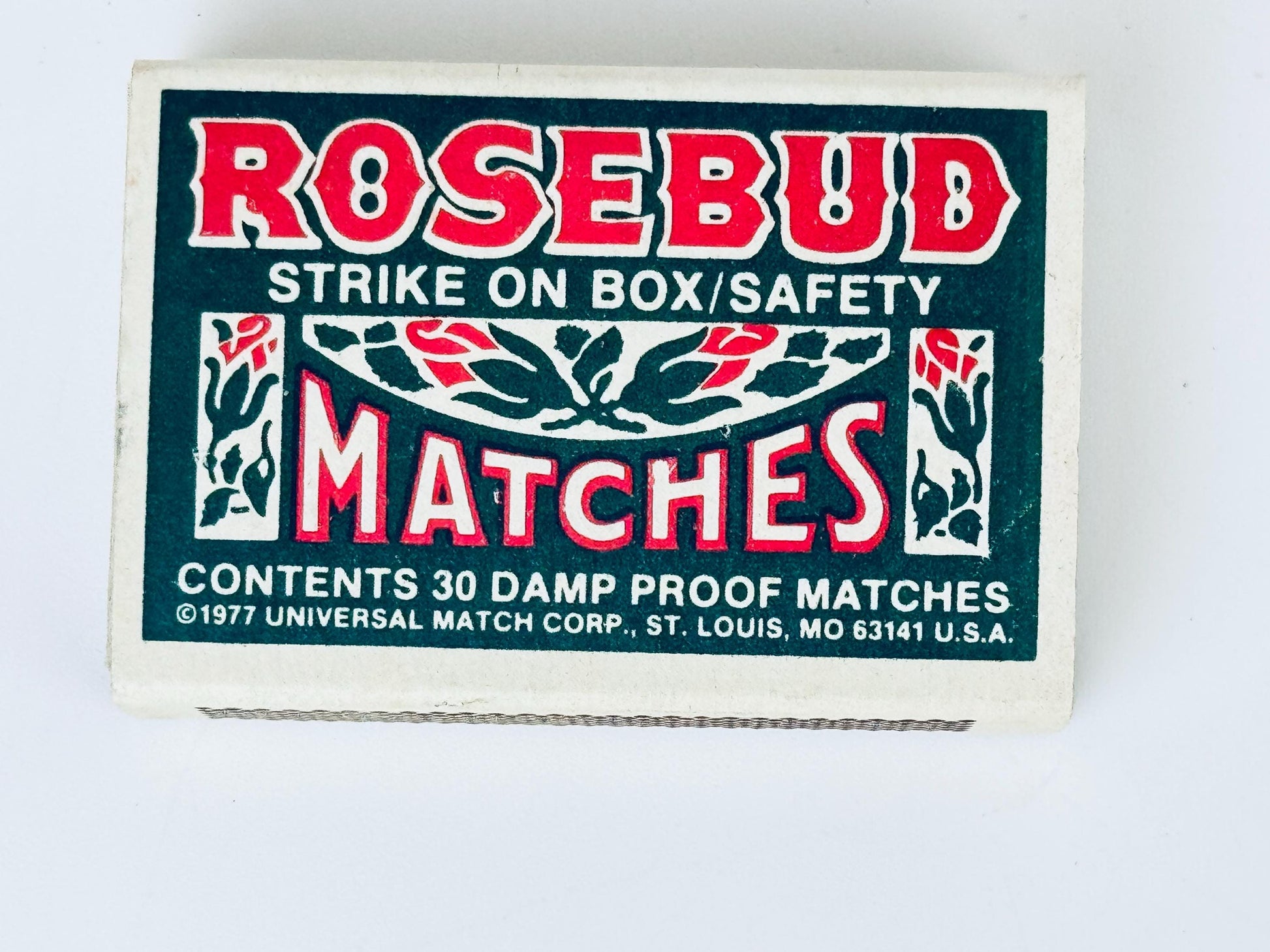 Matchbox labeled 'Rosebud Matches' with branding and product details on a white background