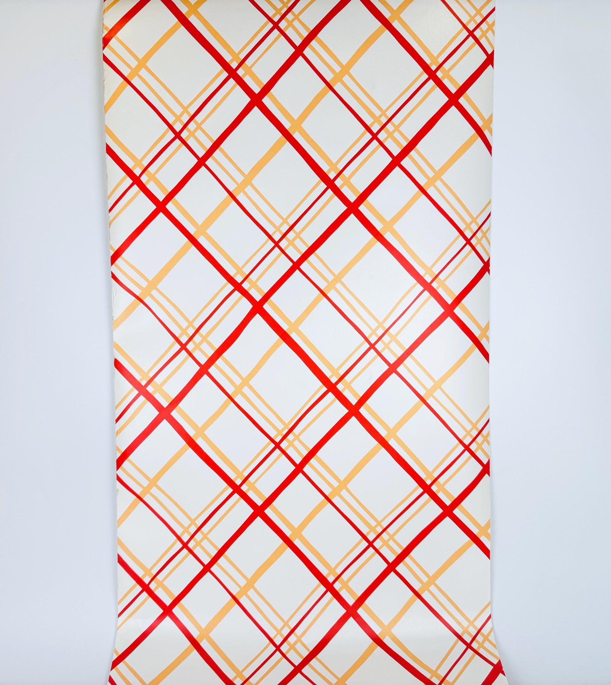 Wallpaper with red and yellow plaid pattern on a white background