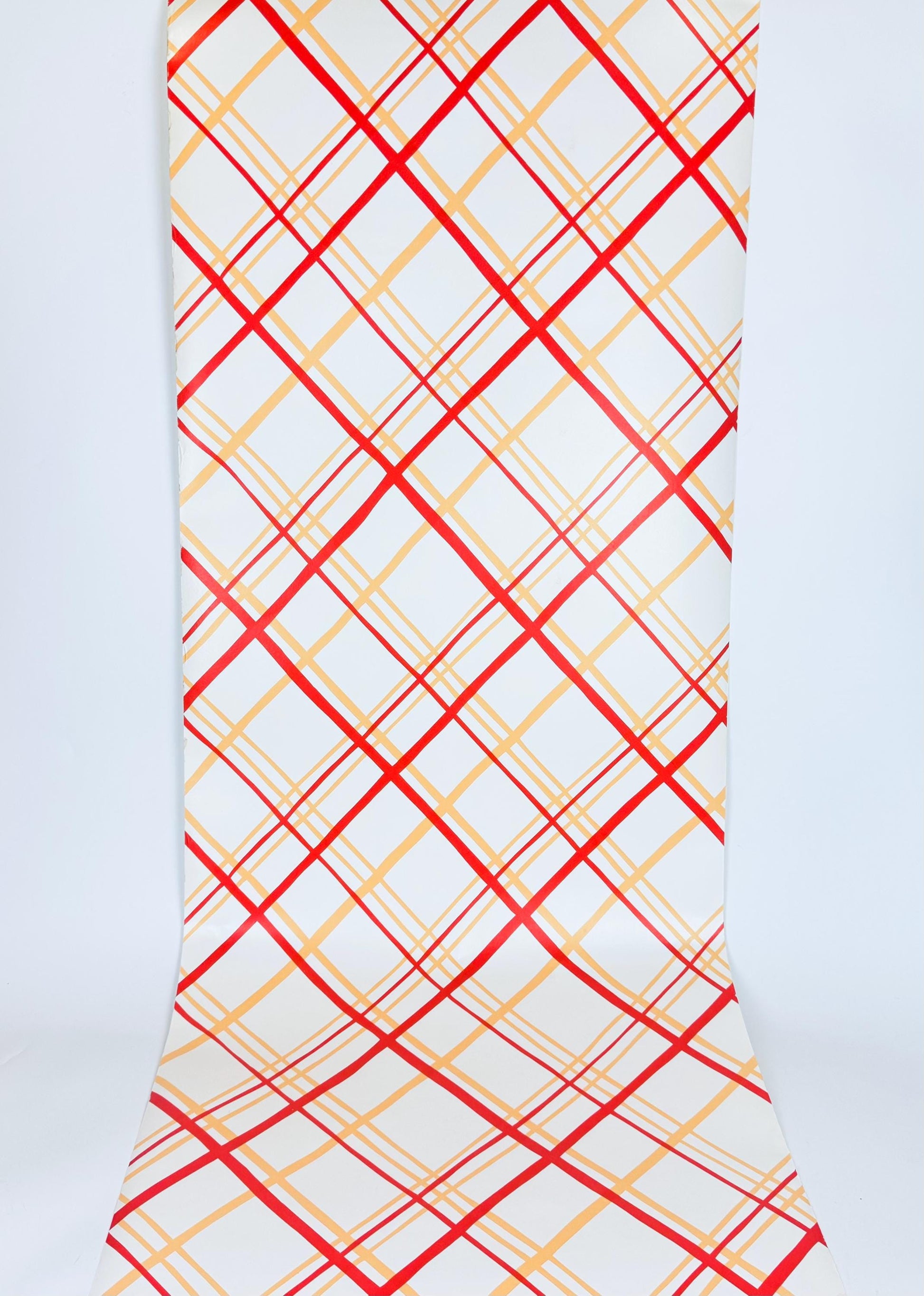 Wallpaper with red and yellow plaid pattern on a white background