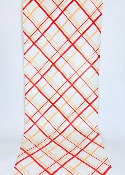Wallpaper with red and yellow plaid pattern on a white background