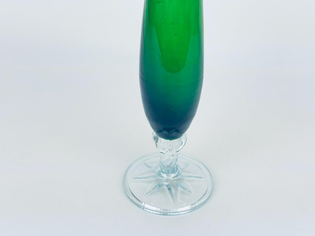 Green glass vase on a white background