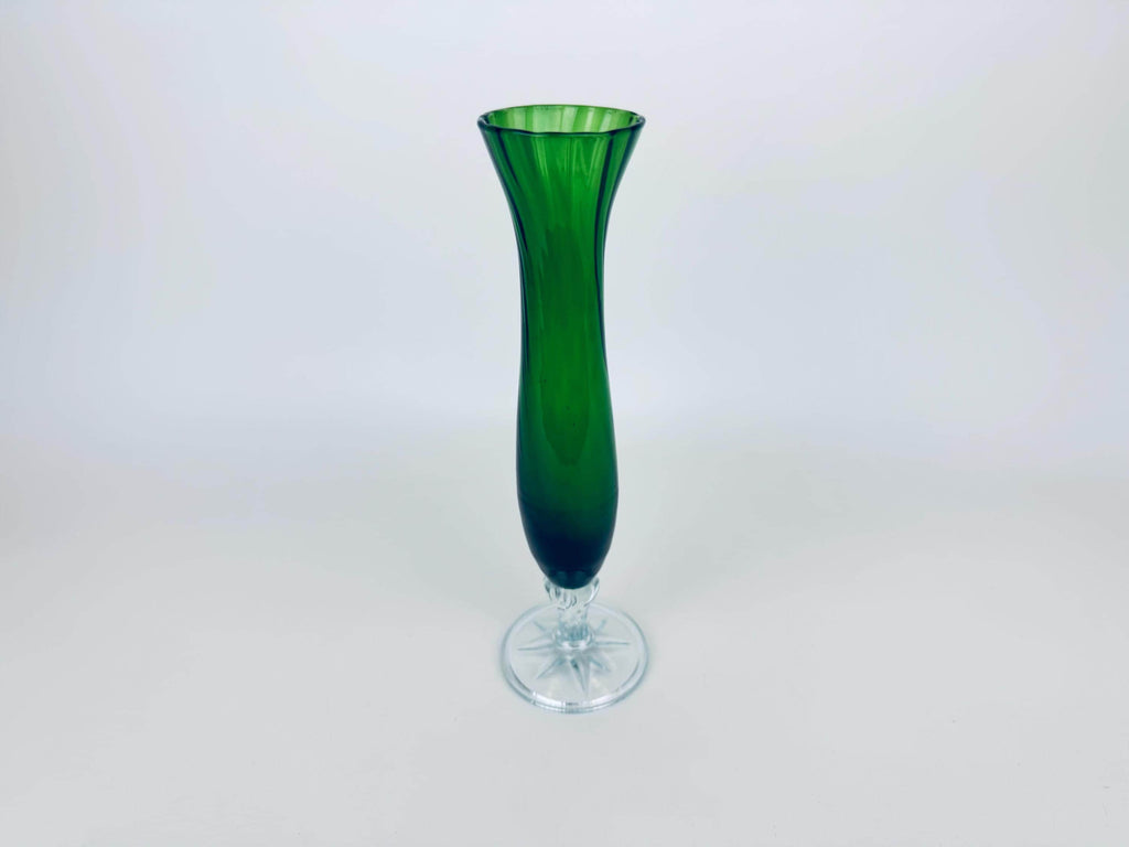 Green glass vase on a white background