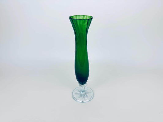 Green glass vase on a white background