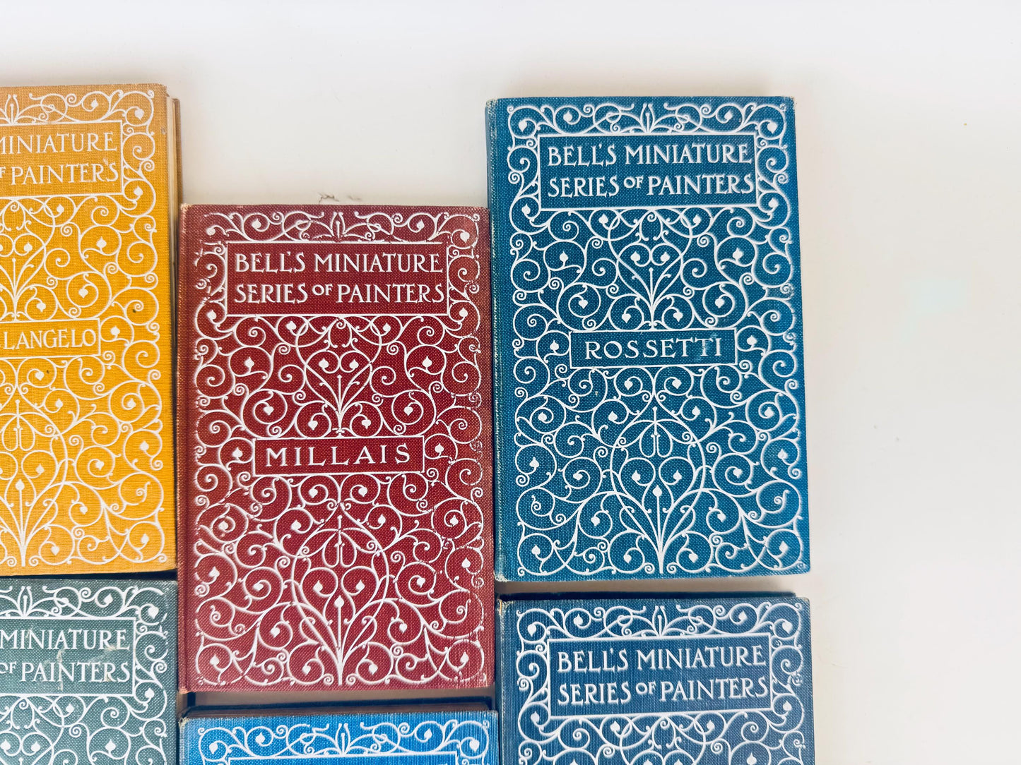 Collection of books titled 'Bells Miniature Series of Painters' in various colors on a white background.