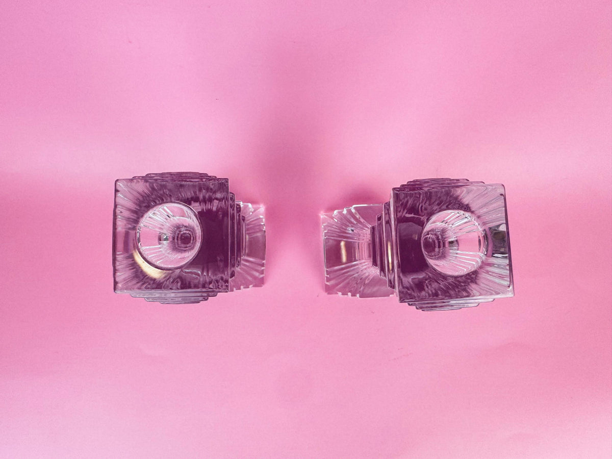 Pair of crystal earrings on a pink background