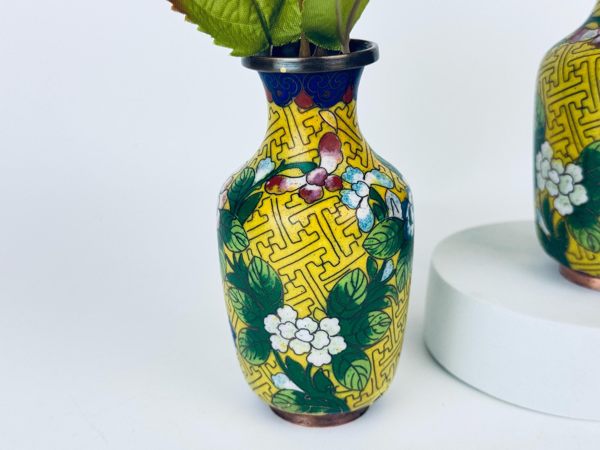 Decorative vase with floral patterns on a white background