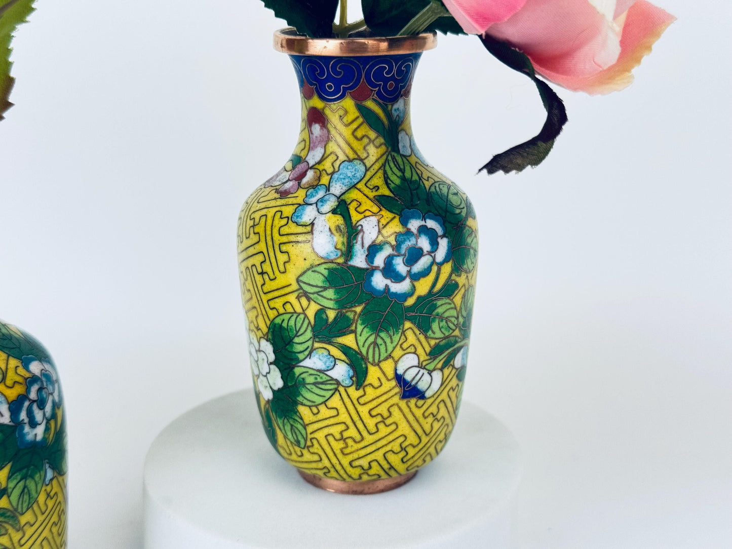 Decorative vase with floral patterns on a white background