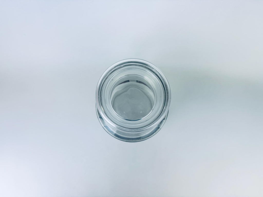 Clear glass jar on a light gray background