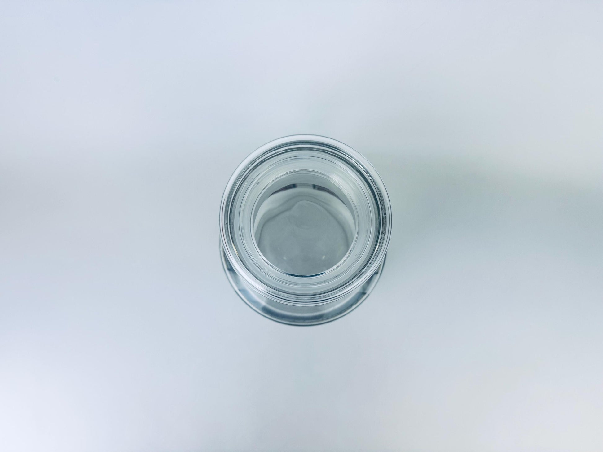 Clear glass jar on a light gray background