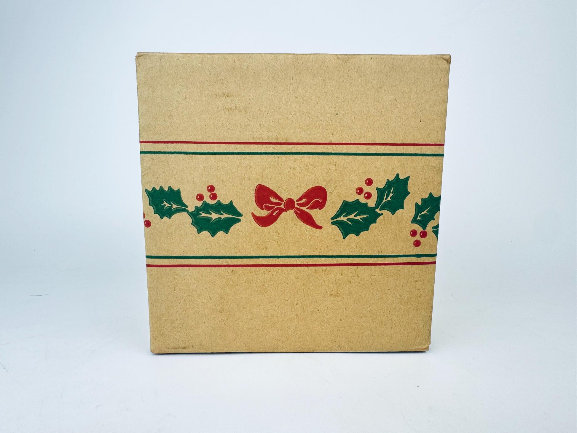 Kraft paper box with Christmas-themed design on a white background