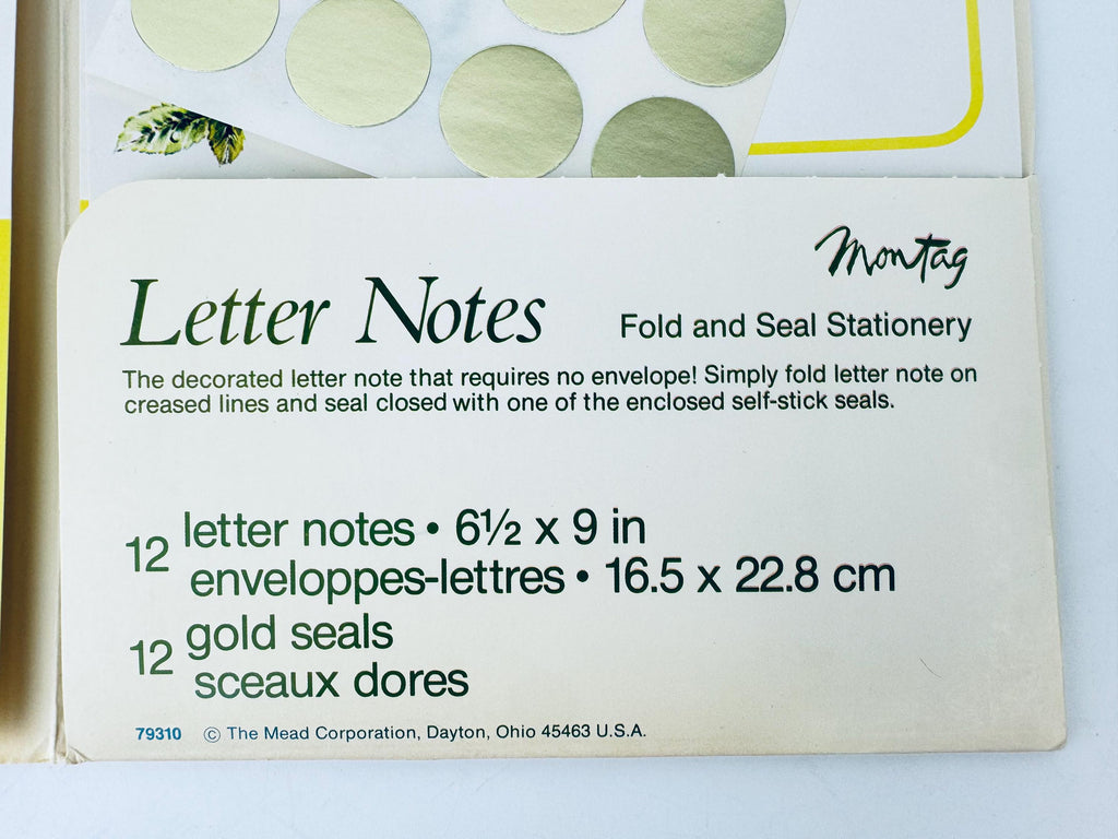 Box of letter notes with gold seals on a white background