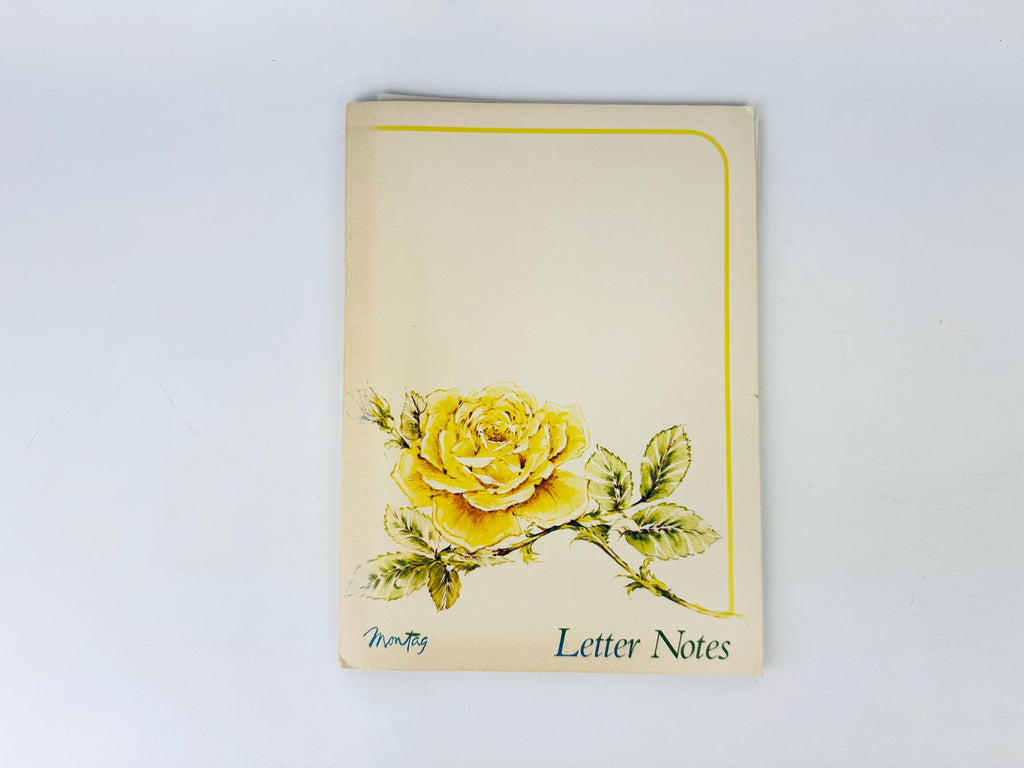 Notebook with a yellow rose illustration on a white background
